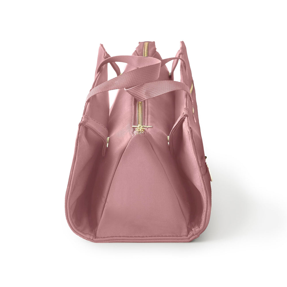 KUSSHI bolsa mauve para viaje, práctica y compacta.