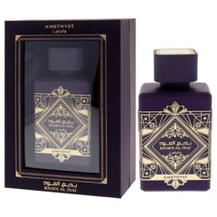 Lattafa Bade'e Al Oud Amethyst bottle emits amber hue for cozy evenings.
