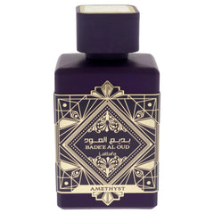 Lattafa Bade'e Al Oud Amethyst bottle top view highlights warm amber-vanilla tones.