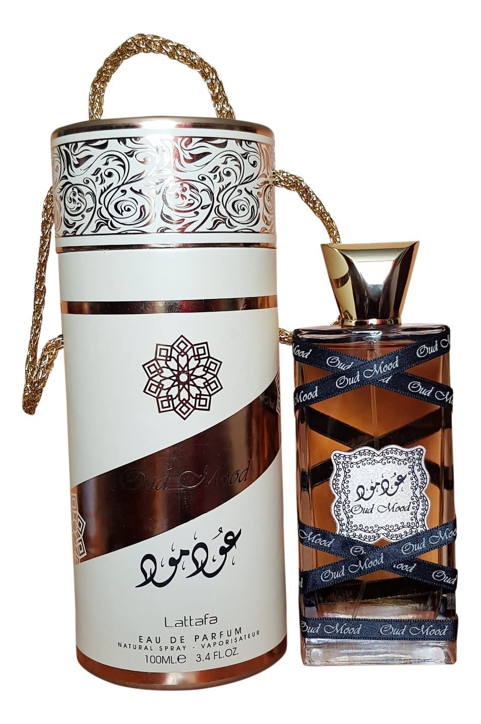 Lattafa Oud Mood base de humo, vainilla y sándalo para calidez duradera.