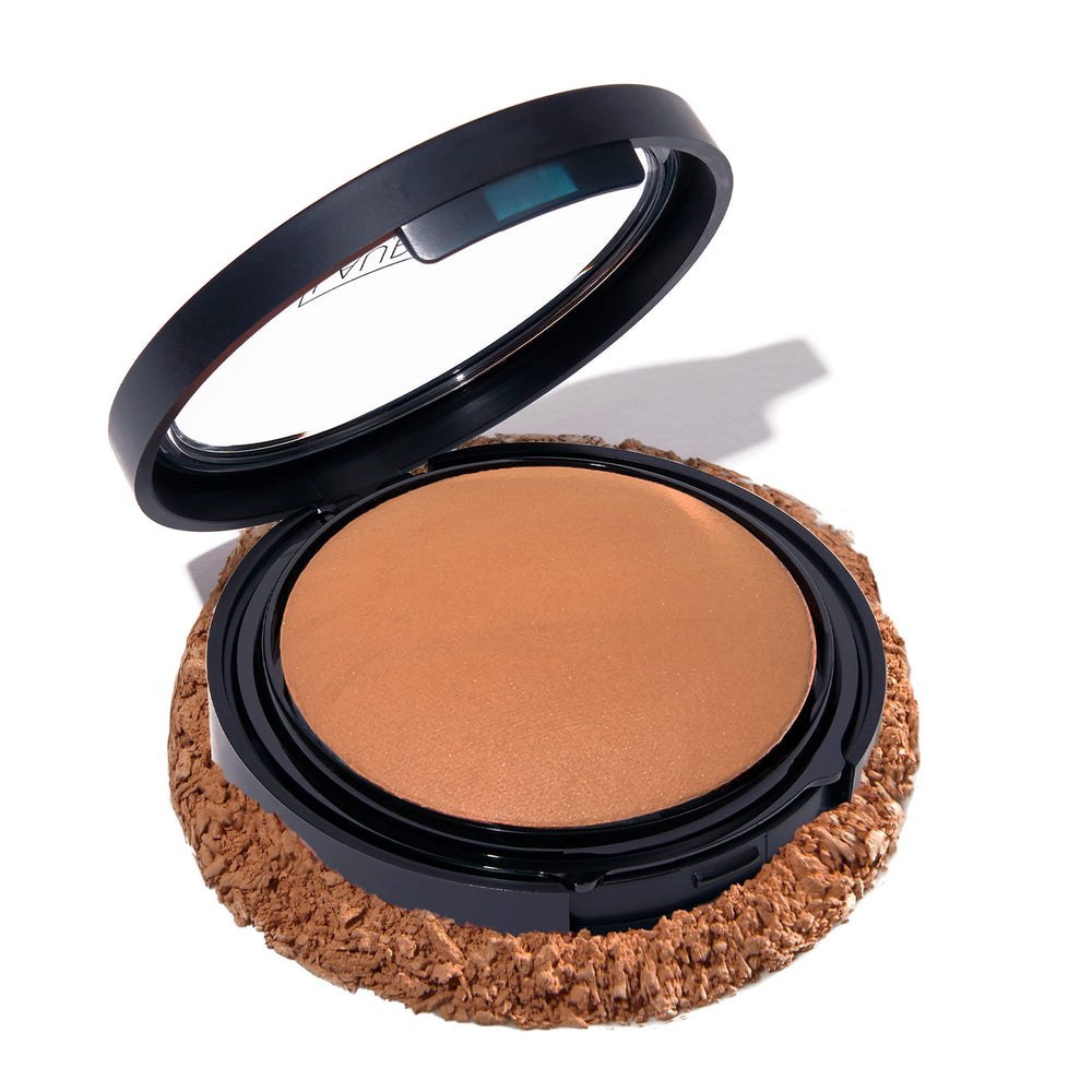 Laura Geller New York Base en polvo Deep con subtonos dorados para tono profundo.