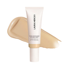 Laura Mercier hidratante tintado natural en botella con SPF 30 para piel radiante.