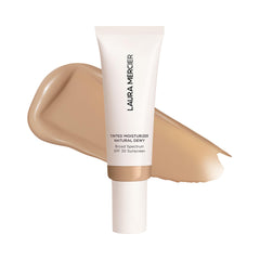 Laura Mercier hidratante tintado, botella visible, hidratación duradera.