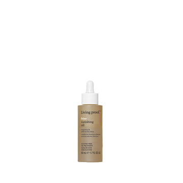 Living Proof No Frizz Vanishing Oil, botella en mano para control del frizz.