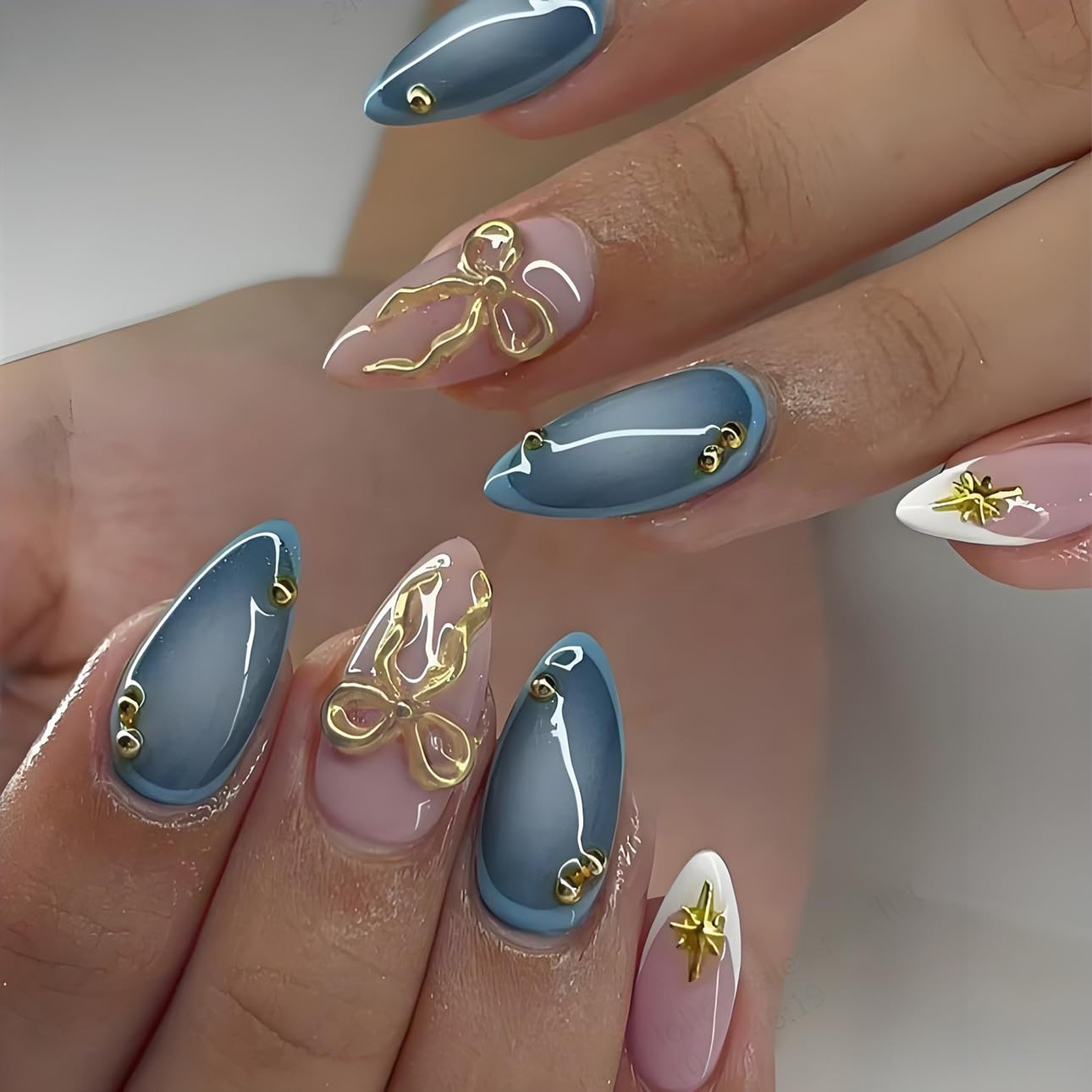 Uñas postizas LPOODDNU en forma de almendra con lazo y estrella para un look elegante