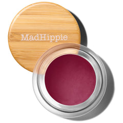 Mad Hippie Tint Plum en envase de vidrio compacto para retoques diarios.