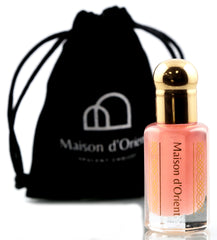 Maison d'Orient Pink Musk en botella, aroma elegante para uso diario.
