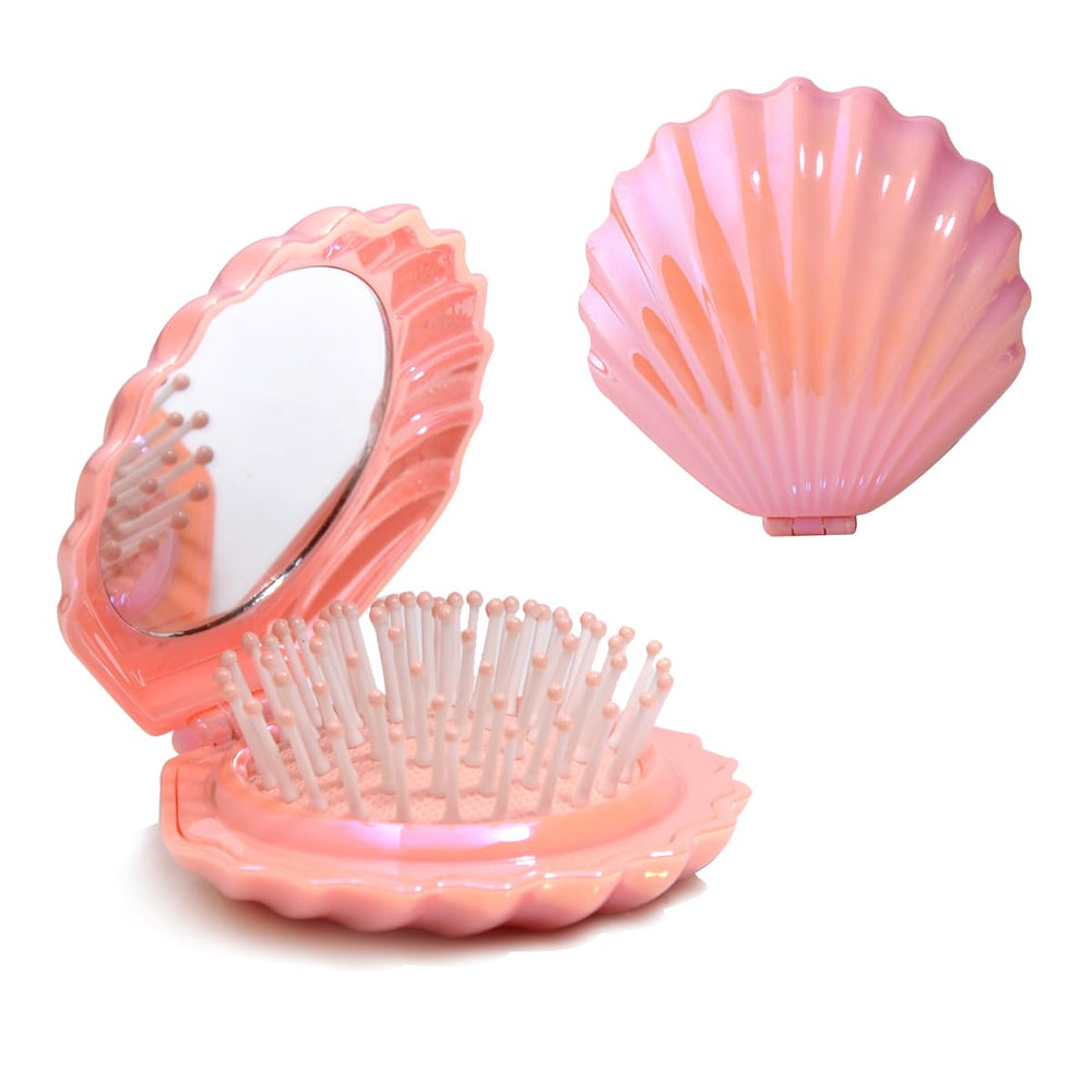 Cepillo de viaje Maji Mama concha plegable y espejo rosa, perfecto para retoques en movimiento.