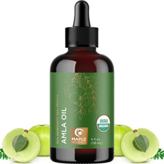 Aceite Amla de Maple Holistics vertido en botella, fácil de aplicar en diario.