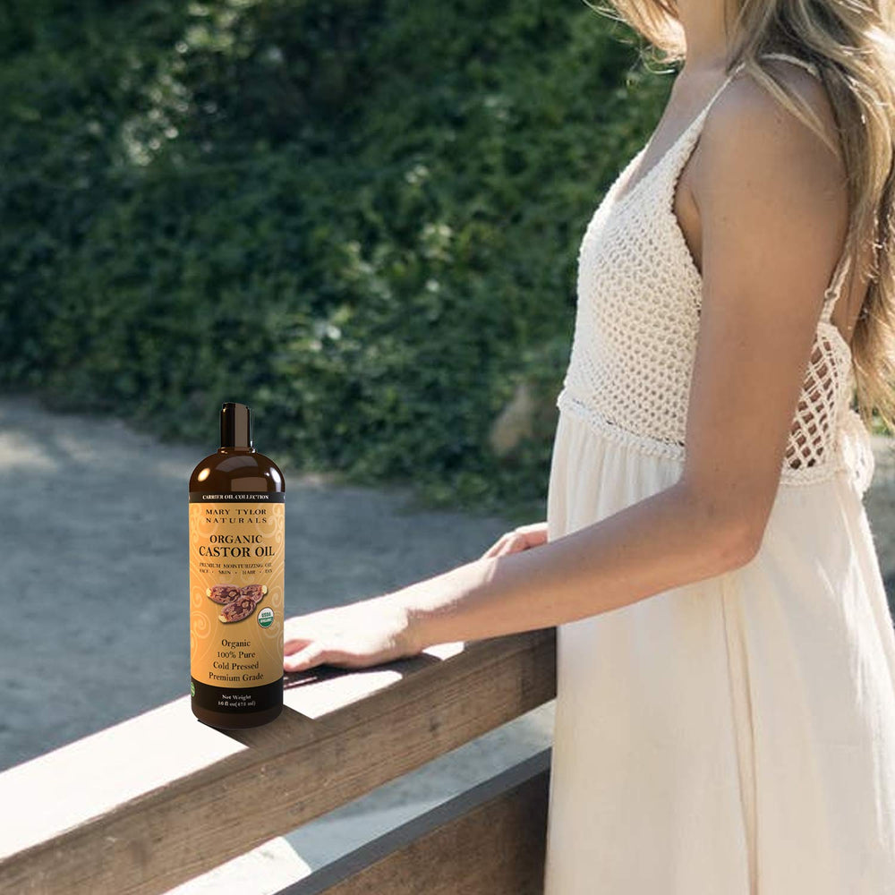 Goteo de aceite de ricino orgánico mostrando textura rica para uso facial y capilar.