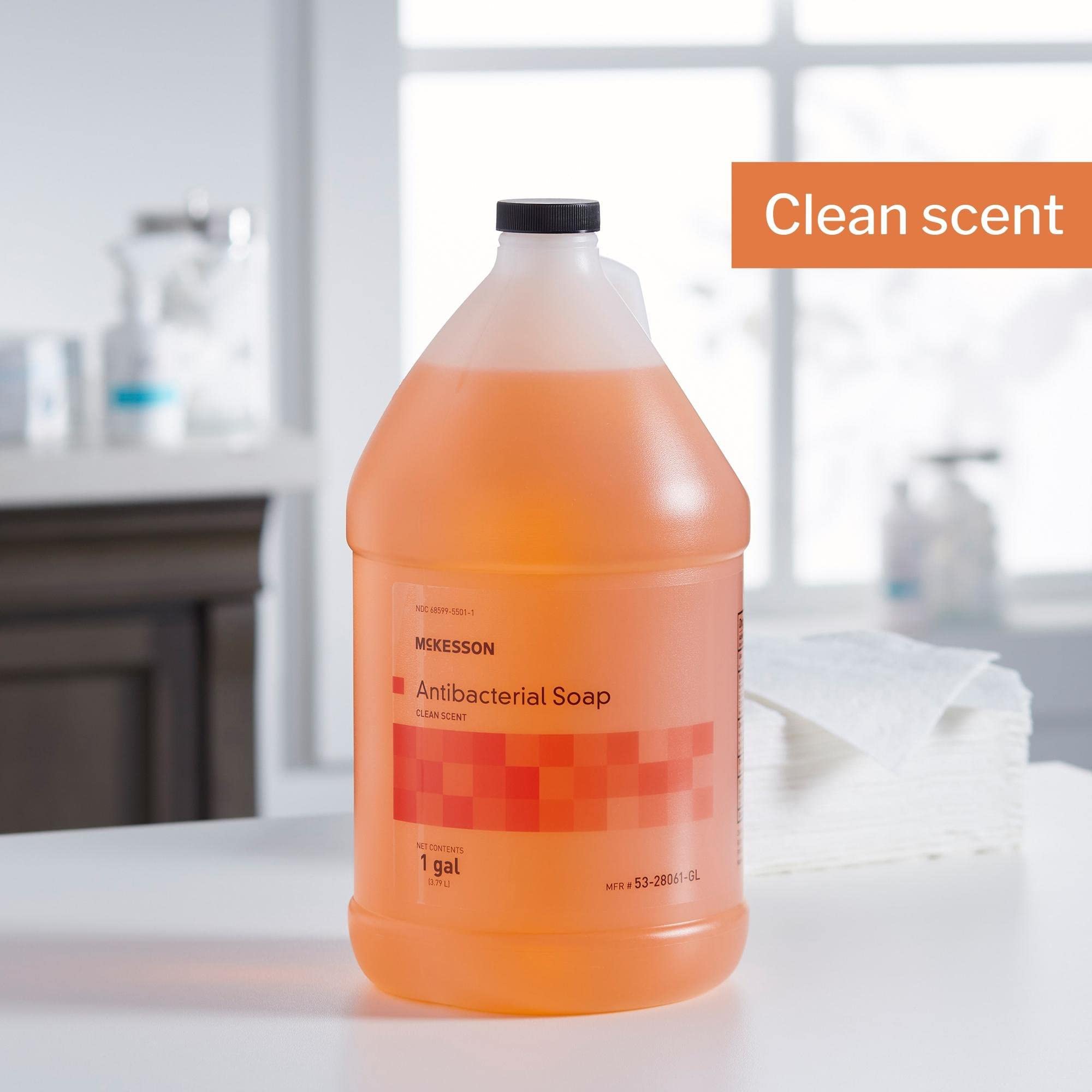 Light orange McKesson hand soap liquid in a bottle.