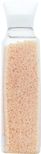 Empaque de Method Fragrance Booster Ginger Mango al lado de detergente.
