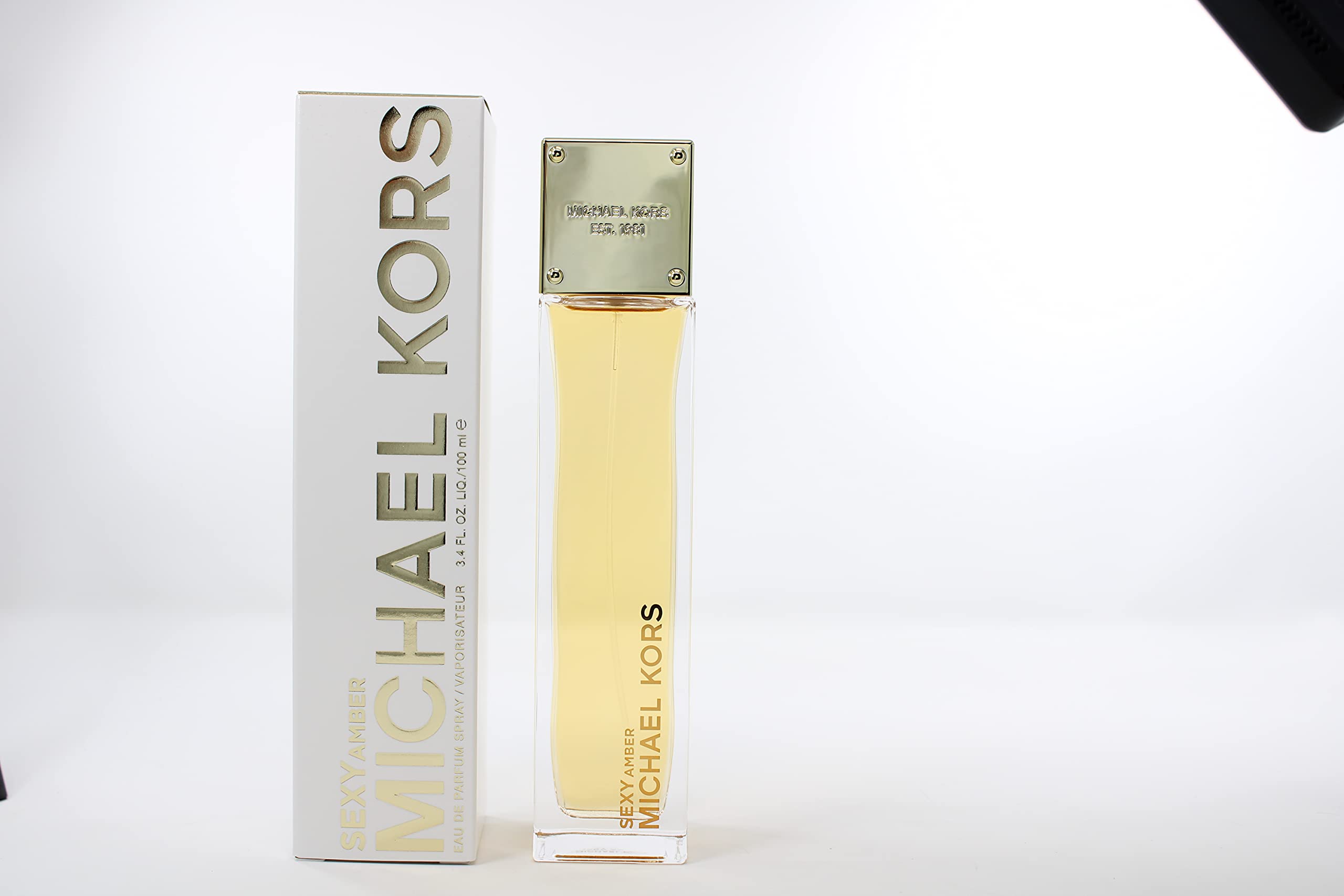 Michael Kors Sexy Amber, embalaje detalle, perfecto para regalo con presentación cuidada.