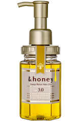 Esta botella de &honey muestra un aceite capilar de hidratación profunda para uso diario.