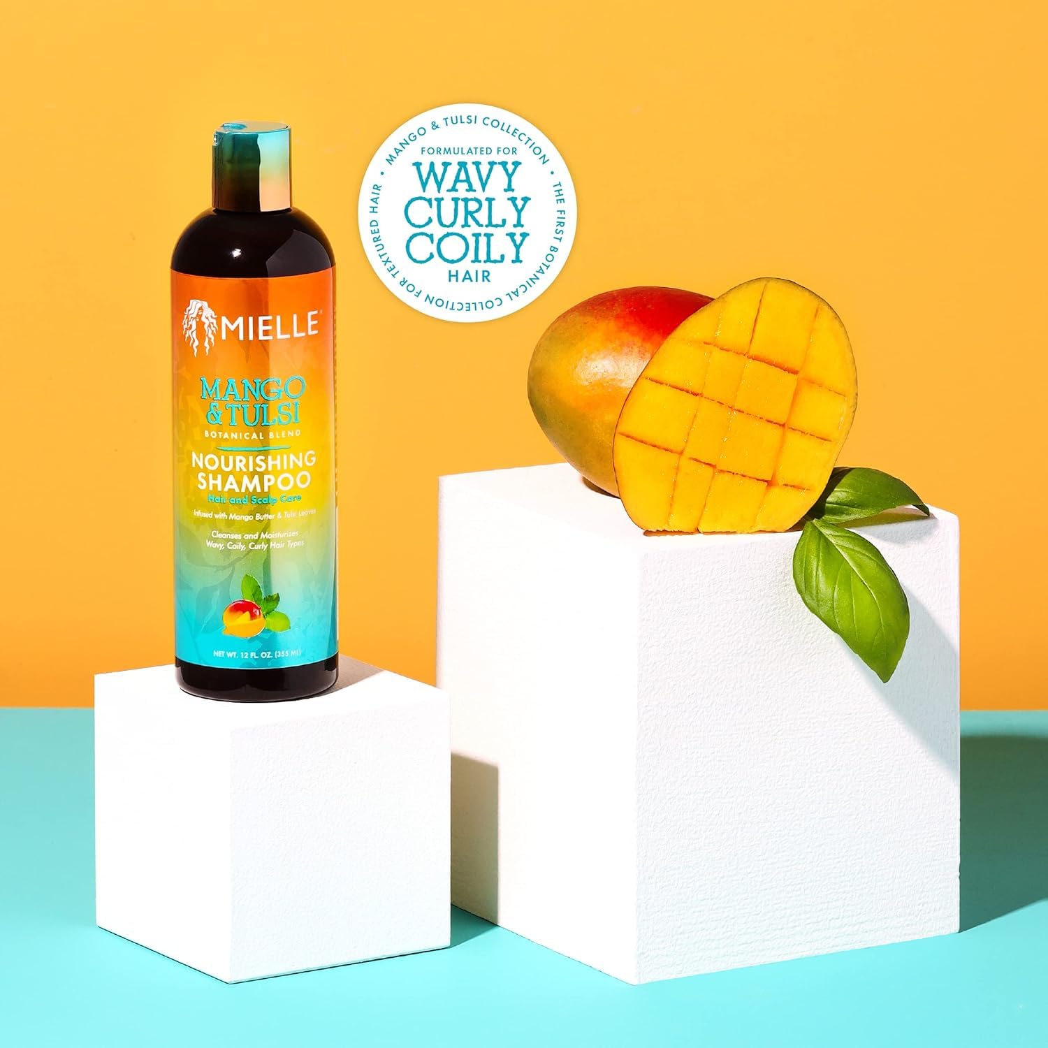 Mielle Organics Mango Tulsi champú cabello rizado: definición y brillo natural.