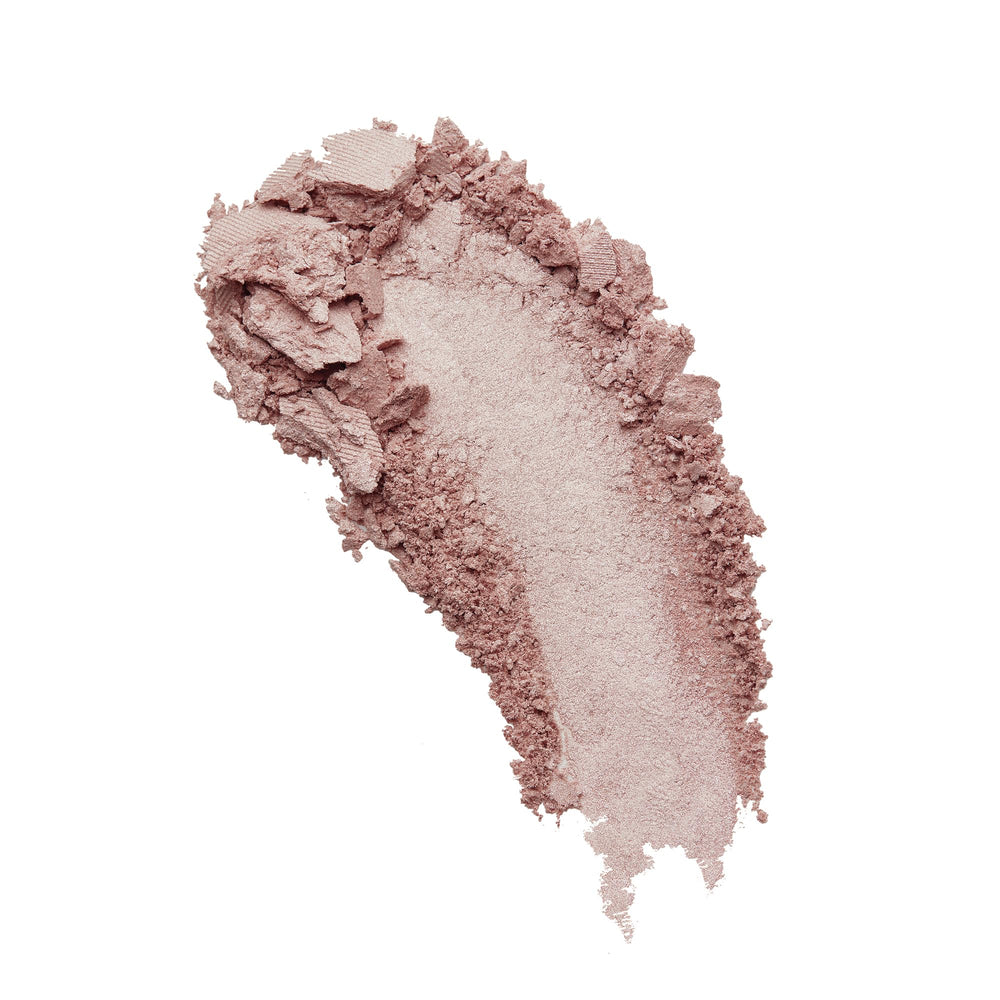 Milani Dolce Perla iluminador horneado brillo natural para piel radiante.