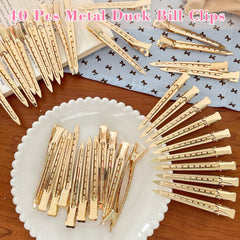 Pinzas Mythos cabello dorado para estilos duraderos y sin deslizamiento.