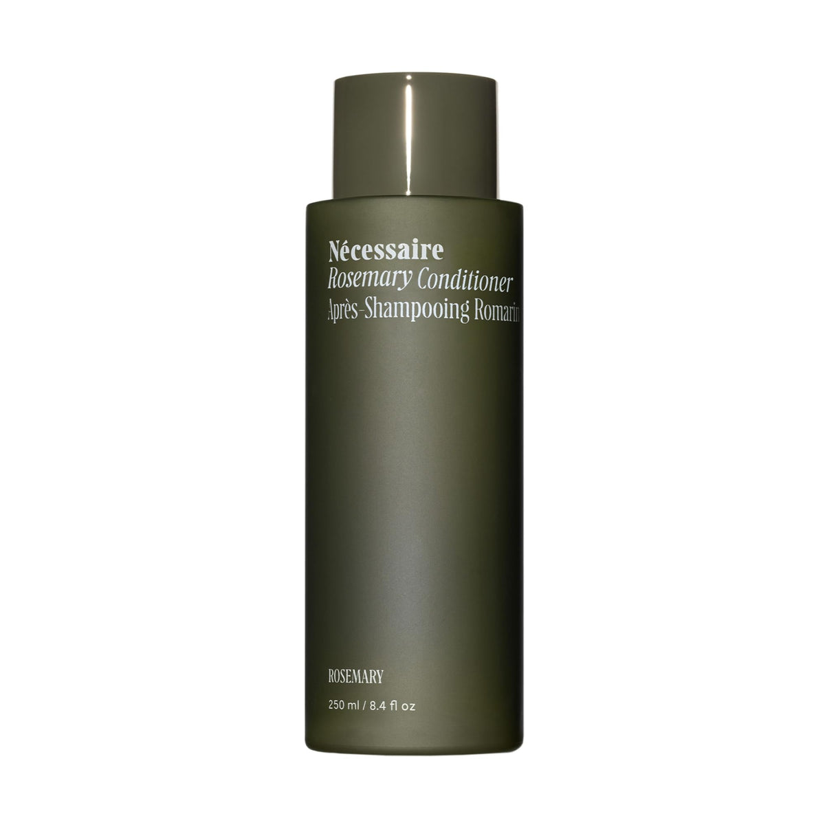Nécessaire Rosemary Conditioner sur bouteille plan de travail, démêlage facilité.