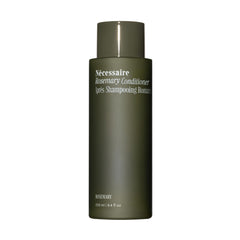 Nécessaire Rosemary Conditioner sur bouteille plan de travail, démêlage facilité.