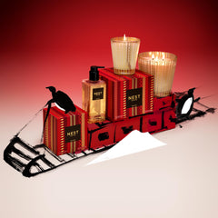 NEST New York savon liquide Noël : agrumes et bois pour une ambiance festive.