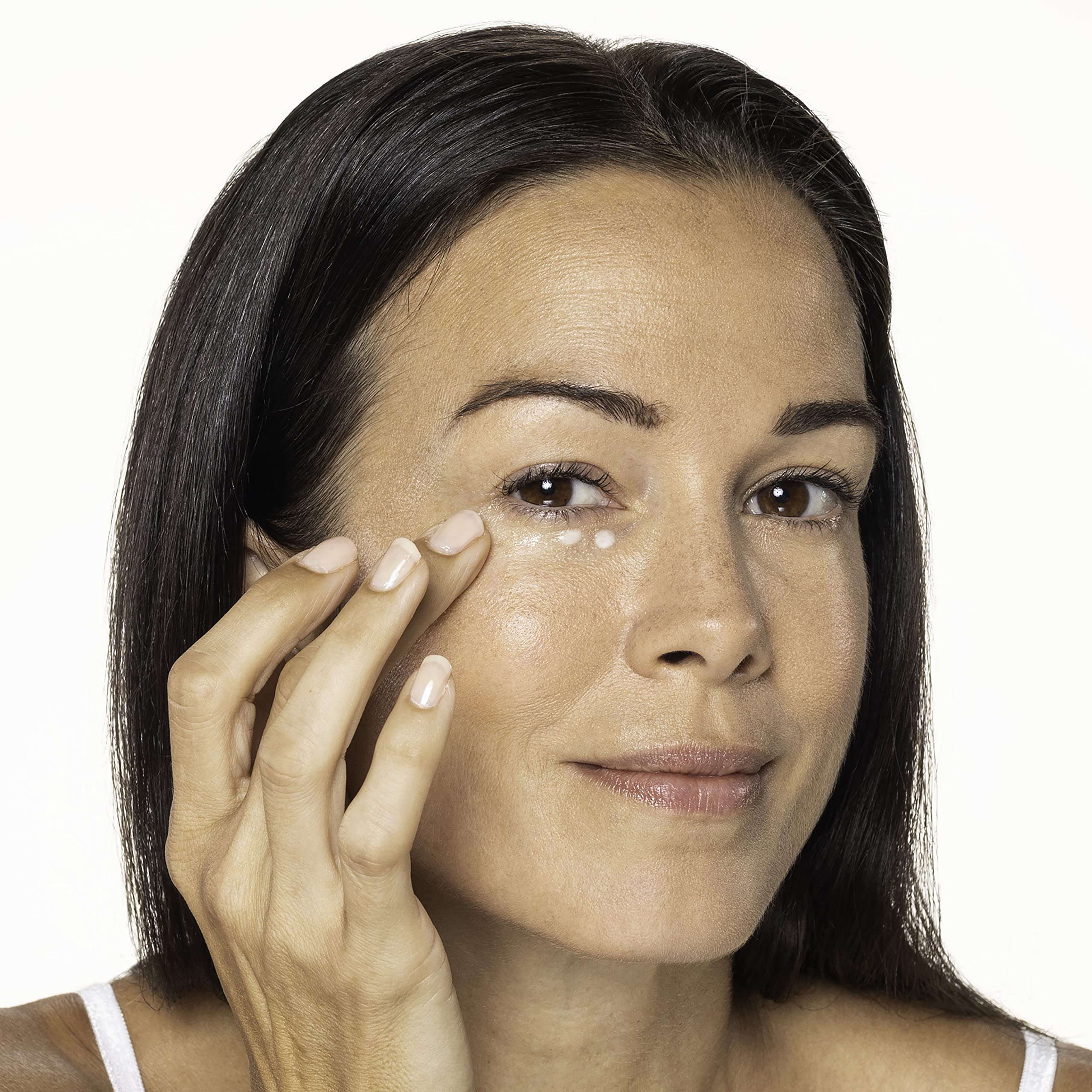 Neutrogena eye cream on the under-eye area targeting dark circles.