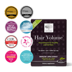 NEW NORDIC tabletas volumen cabello: comprimidos en primer plano con textura suave