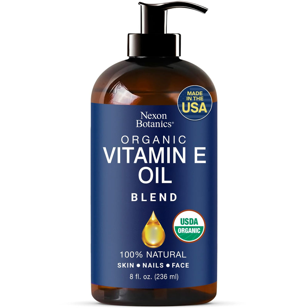 Nexon Botanics Aceite Vitamina E: mezcla orgánica en bote oscuro para cuidado diario de la piel.