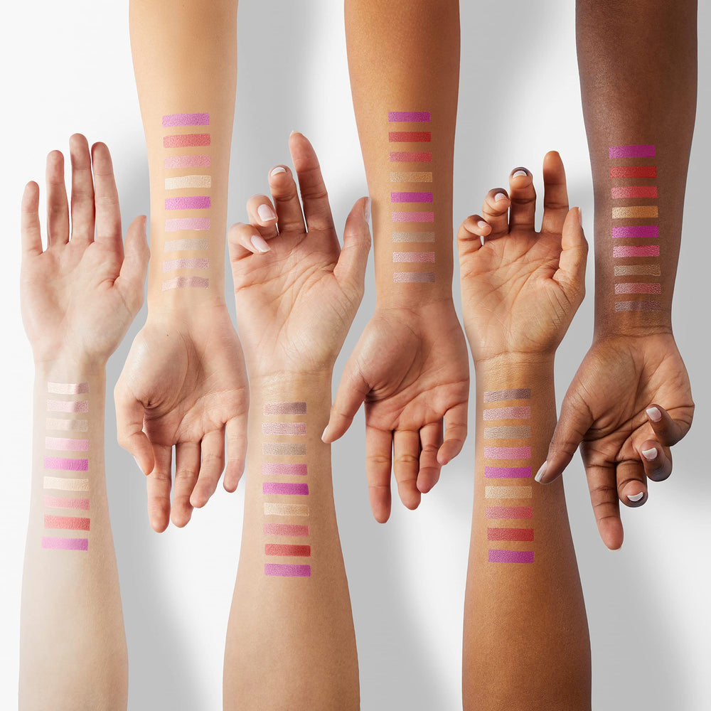 Nicole Miller lip gloss packaging close-up emphasizing premium wand and sleek design.