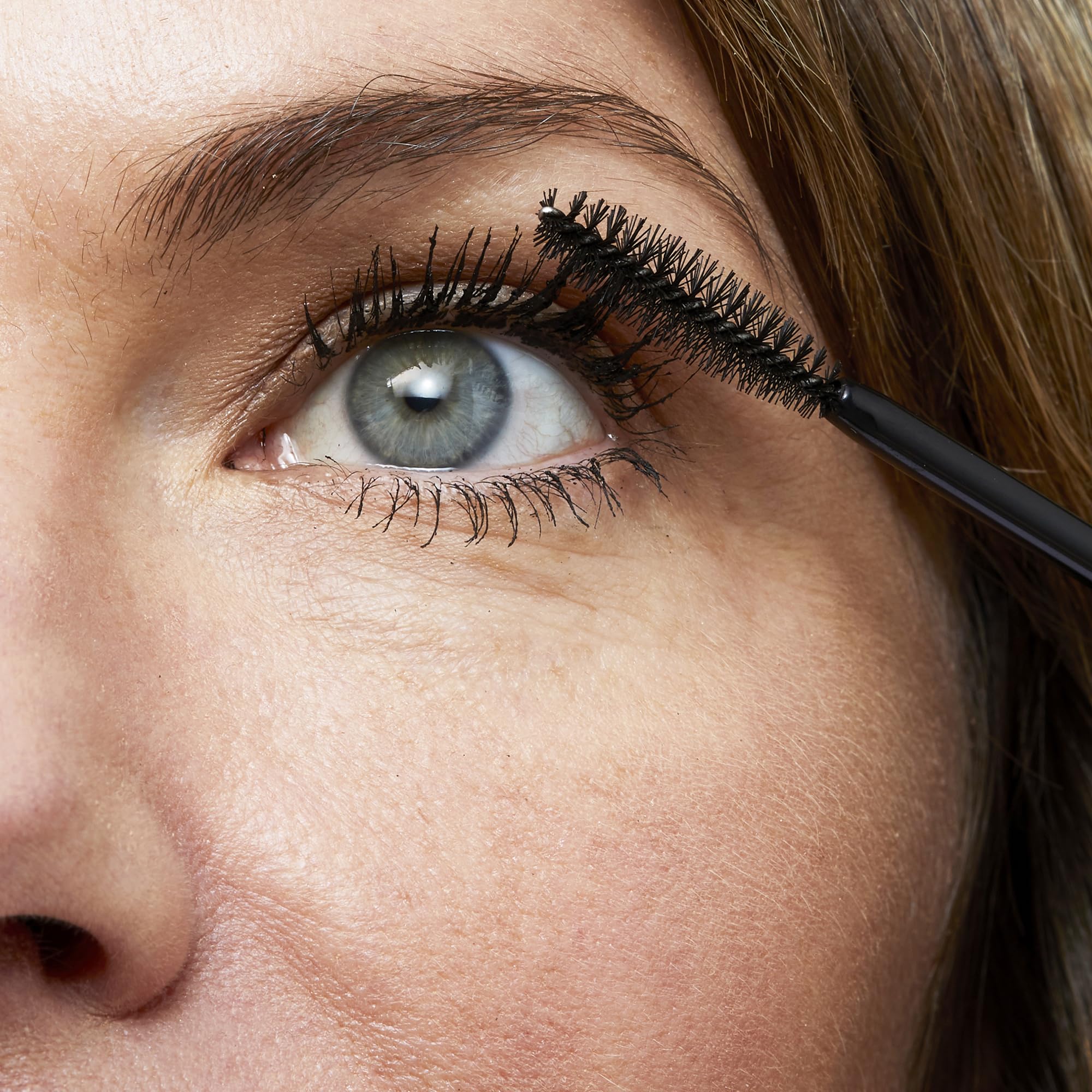 No7 Age Defying Eye Mascara wand in use with smudge-free wear