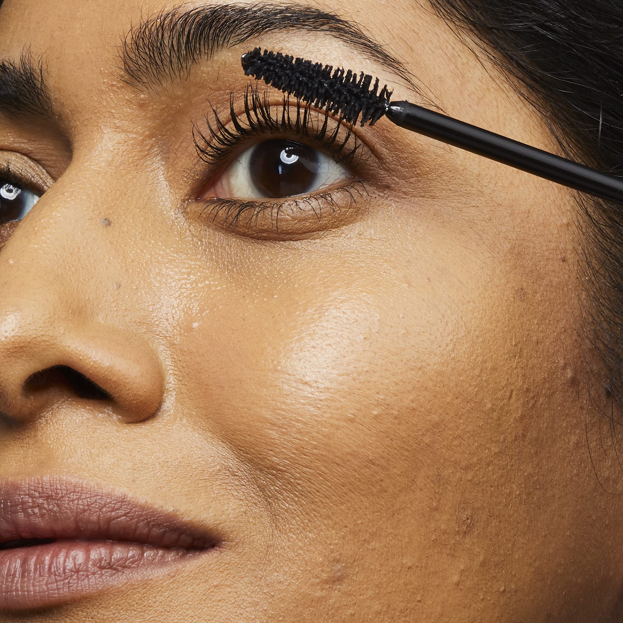 Close-up of straight brush in action providing even lash coat for No7 mascara.