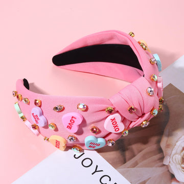 Diadema NVENF Valentine con nudo superior rosa, look sofisticado.