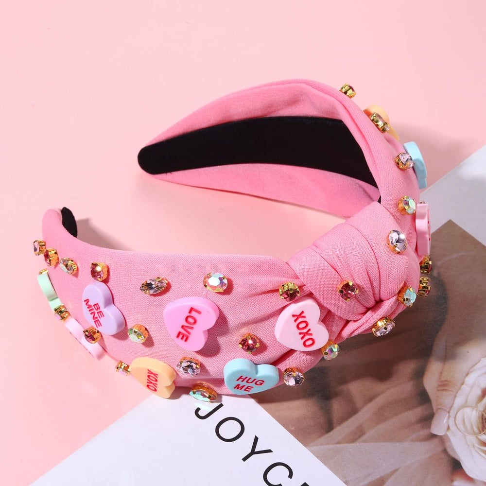 Diadema NVENF Valentine con nudo superior rosa, look sofisticado.