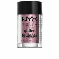 NYX Brillo para cara y cuerpo tono rosa, ideal para looks glam.