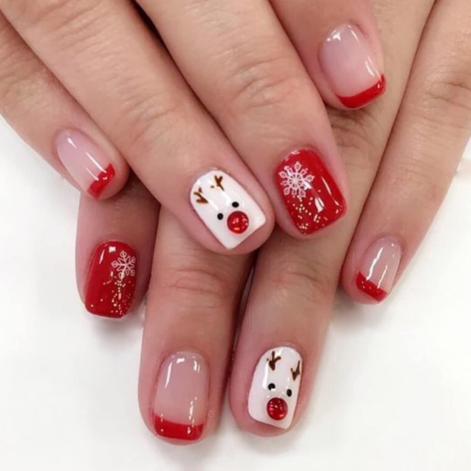 Uñas falsas OCOUYVD navideñas con punta francesa roja para un look festivo.