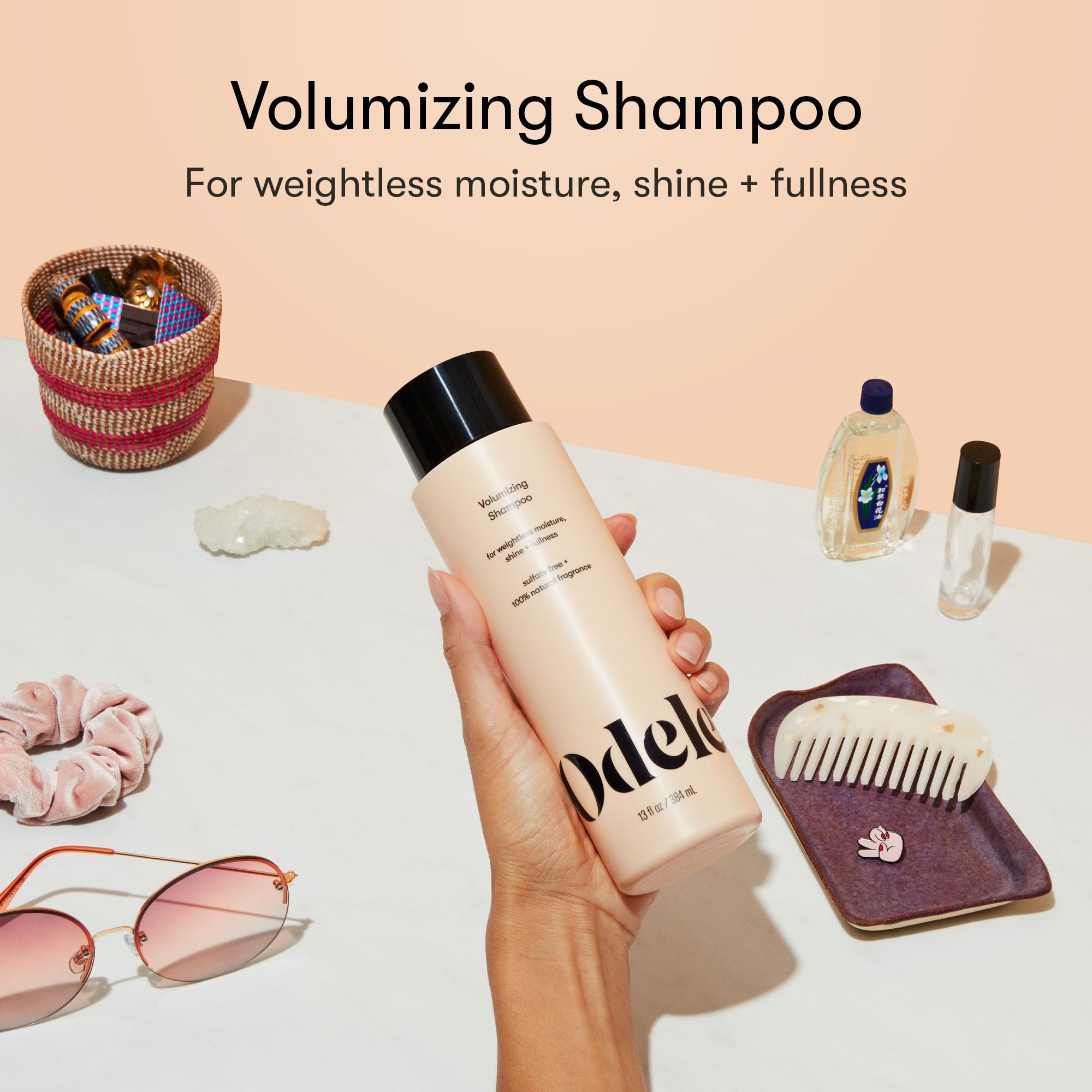 Odele Volumizing Shampoo foaming lather ready for gentle scalp massage.