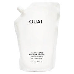 OUAI condicionador medio: envase recargable para cuidado eficiente del cabello.