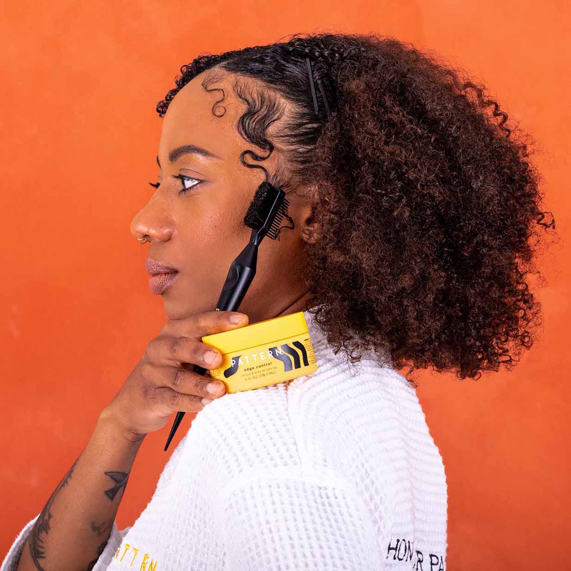 PATTERN Edge Control on hair for a slick finish without flaking.