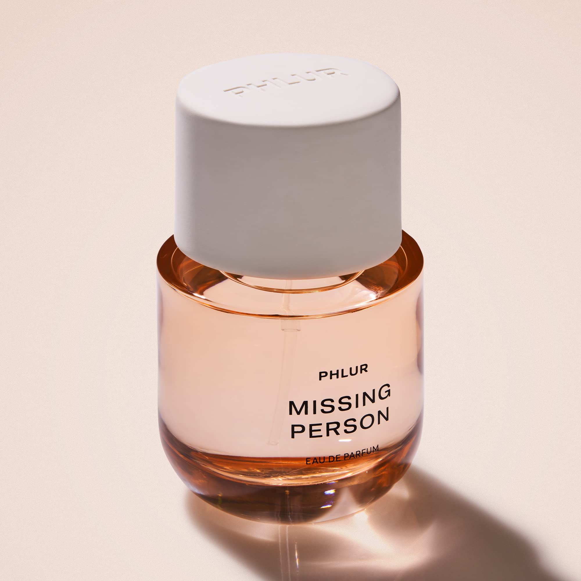 PHLUR Missing Person bottle emphasizes bergamot top notes for a fresh daytime vibe.