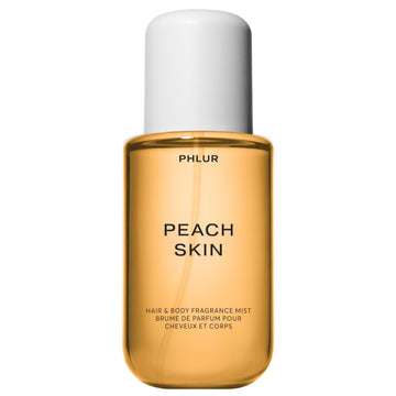 PHLUR Peach Skin Body Mist en botella elegante para uso diario suave.