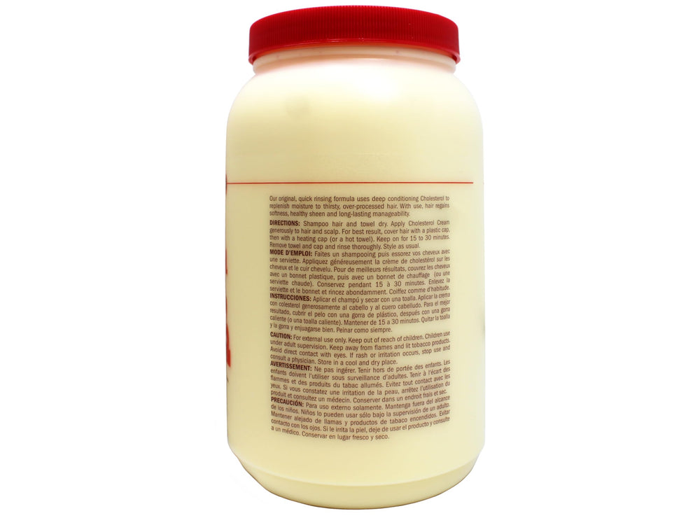 Applying Queen Helene Cholesterol Hair Conditioning Cream to hair for improved manageability.