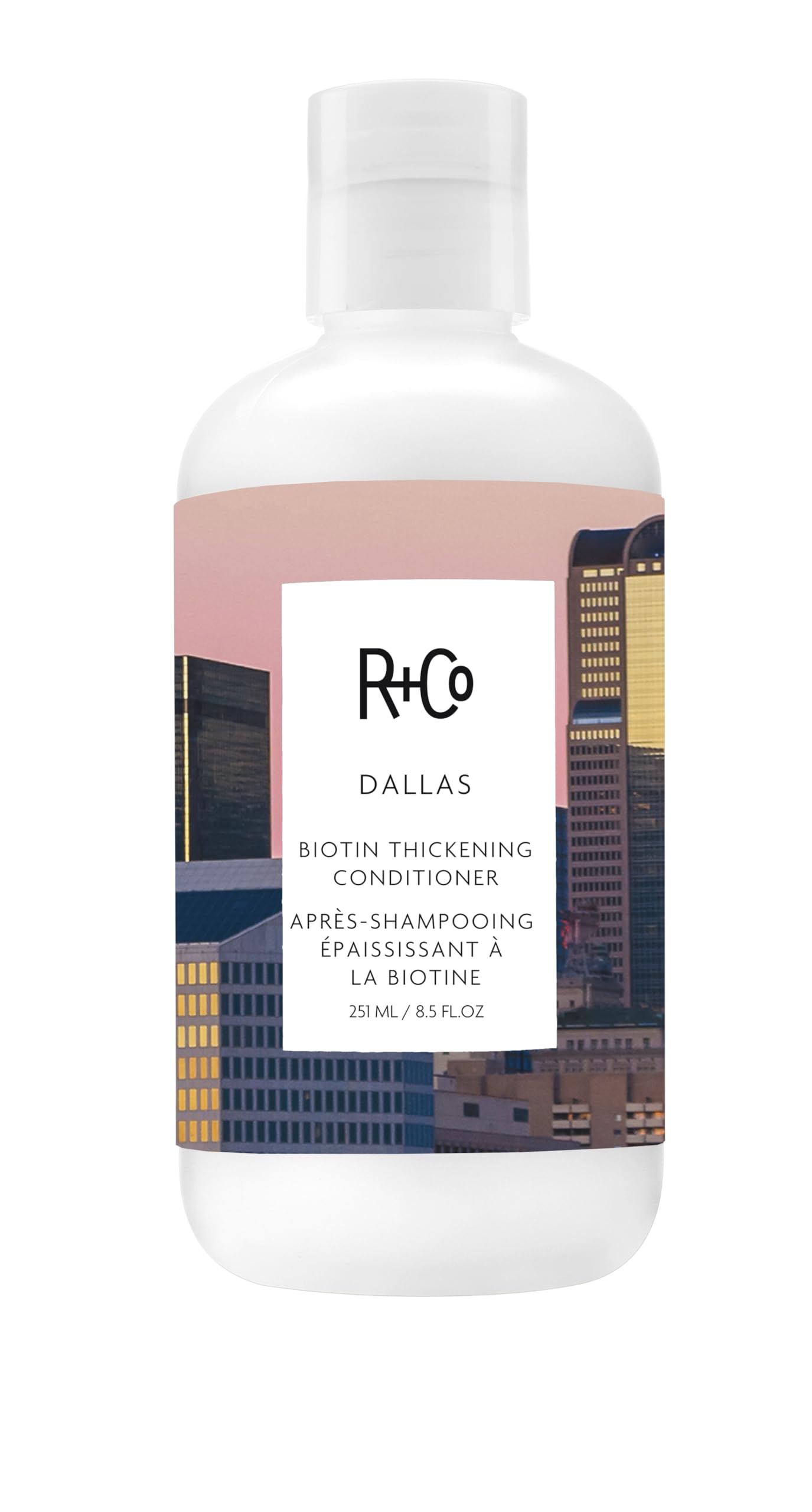 Acondicionador engrosador con biotina de R+Co Dallas, botella visible y cuerpo ligero