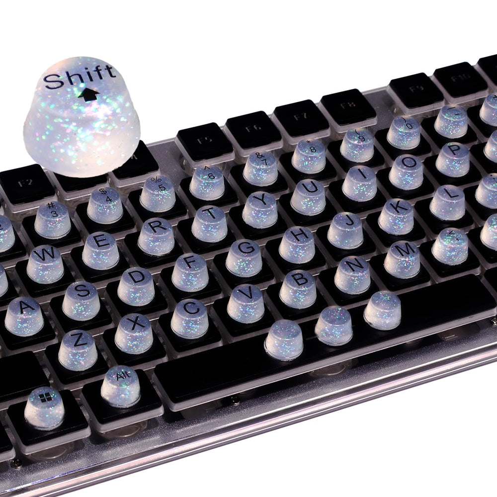 Raised Button: teclas elevadas para uñas largas, mejora precisión y comodidad al teclear.