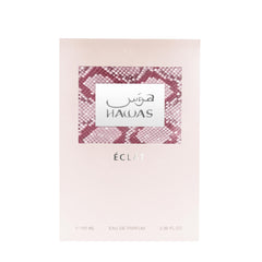 Rasasi Hawas Eclat para Mujer, detalle acento oro-rosado, presentación premium para ocasiones especiales.