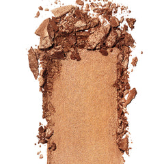 Bronceador prismático REVLON con pigmentos cristalizados para bronceado suave.