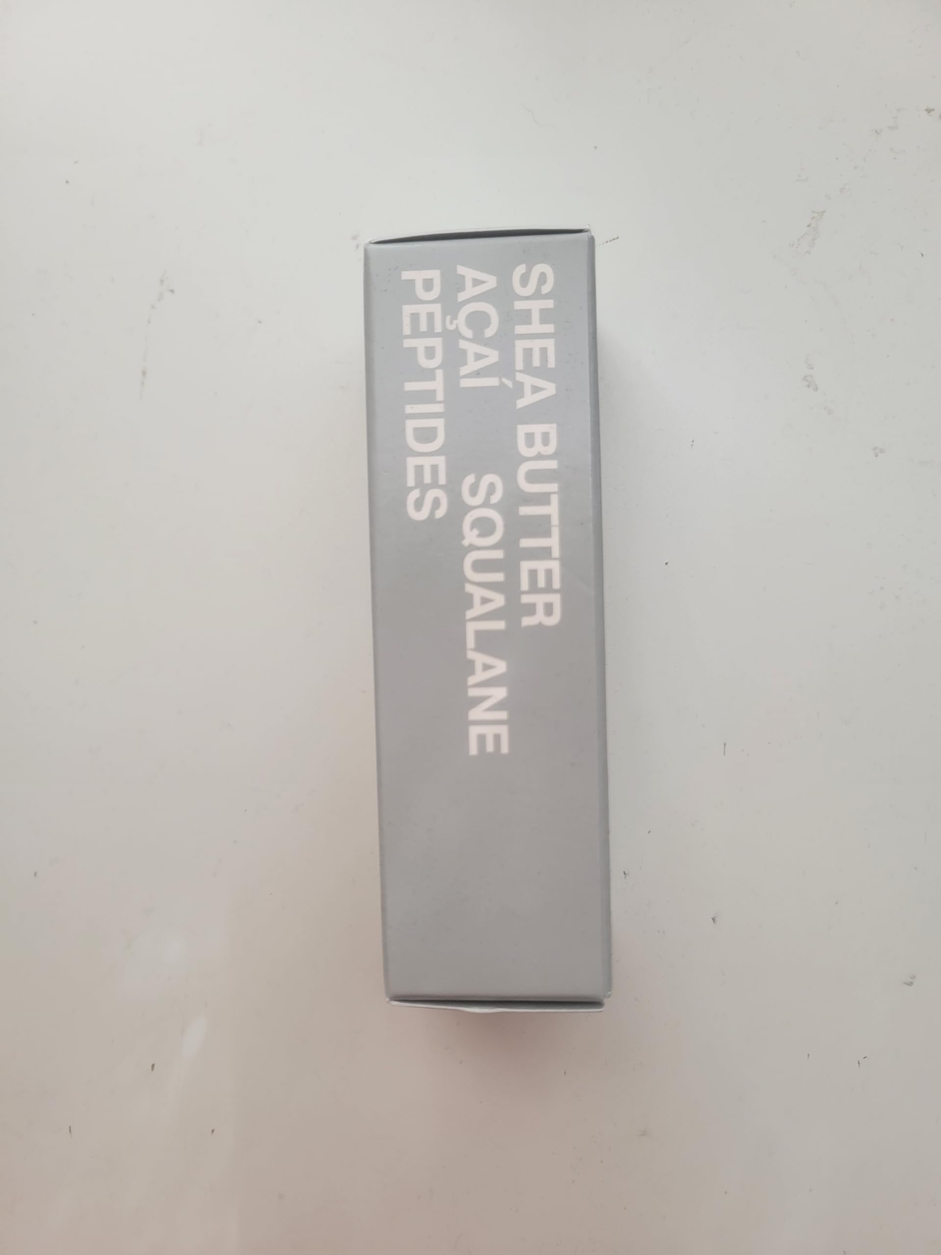Rhode Barrier Restore Cream in hand during gentle application.