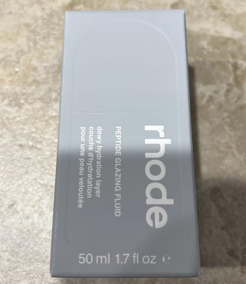 Close-up of Rhode Barrier Restore Cream label highlighting barrier-support formula.