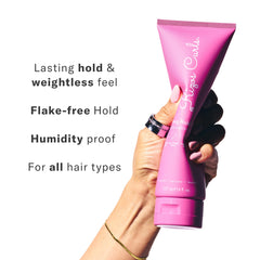 Rizos Curls Strong Hold Gel applying to coils for frizz control.