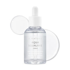 S.NATURE Aqua Squalane Serum, botella iluminada, hidratación suave para piel cansada.