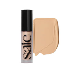 Saie Slip Tint Corrector crema en bote, corrección suave de imperfecciones para ojeras y rojeces.