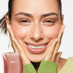 Saie Glossybounce doe-foot applicator for precise, even lip coverage.